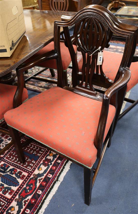 A set of six 19th century mahogany shield-back dining chairs and six matching reproduction chairs